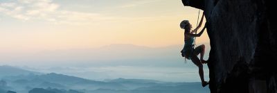 A girl climbing the mountain