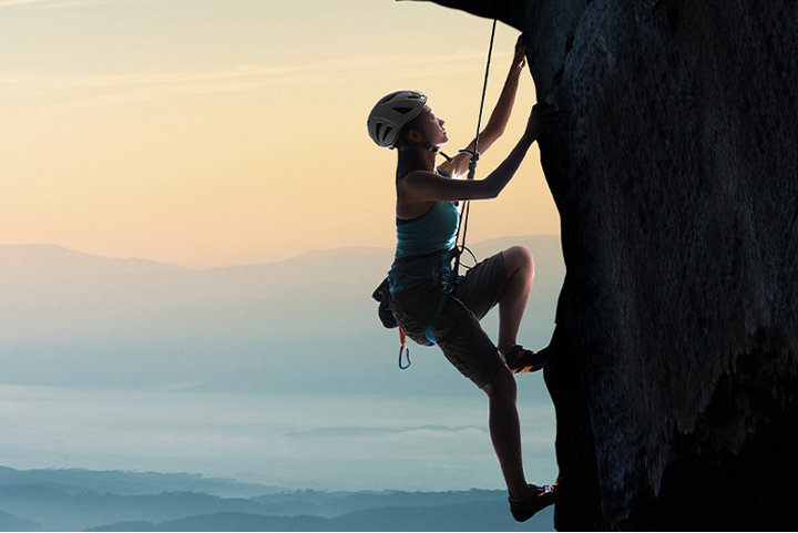 A women doing rock climbing